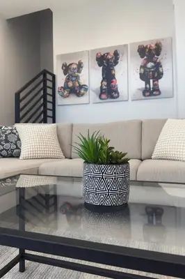 a living room with a couch and a glass table at Art District Stay Wynwood & Design District Nearby in Miami
