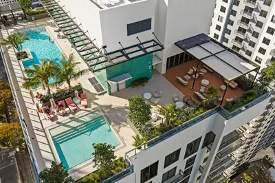an overhead view of a building with two swimming pools at Brand new Studio at The Crosby Miami Worldcenter in Miami