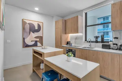 a kitchen with a sink and a counter top at 2BR Corner Suite MIA Wrap Balcony Rooftop Pool in Miami