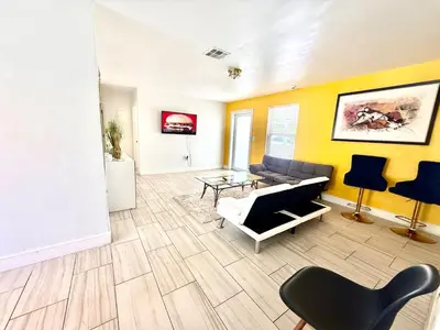 a living room with a couch and a table at Better Experience Property in Miramar