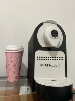 a black and white coffee maker next to a cup at Studio Apartment with backyard - All Private! in Homestead