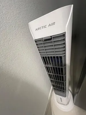 a white air conditioner sitting on top of a wall at Studio Apartment with backyard - All Private! in Homestead