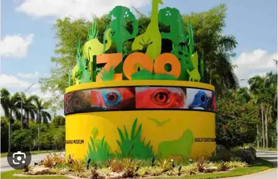 a sign that says zoo with a dinosaur on it at Studio Apartment with backyard - All Private! in Homestead