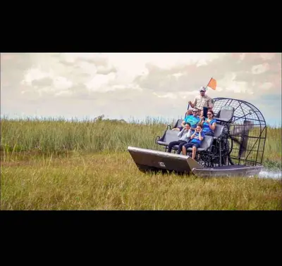 a group of people sitting in a spiderweb ride at Studio Apartment with backyard - All Private! in Homestead