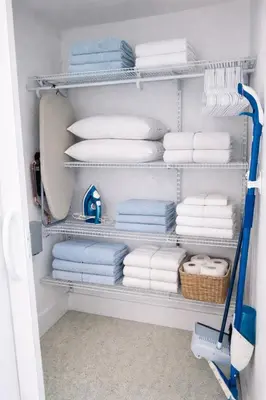a laundry room with towels and a vacuum at Villa Clara ROYAL-Little Havana in Miami