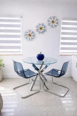 a glass table with two chairs and a bowl on it at Villa Clara ROYAL-Little Havana in Miami