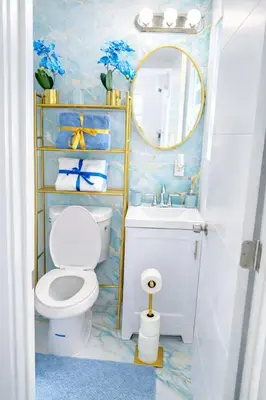 a bathroom with a toilet and a sink and a mirror at Villa Clara ROYAL-Little Havana in Miami