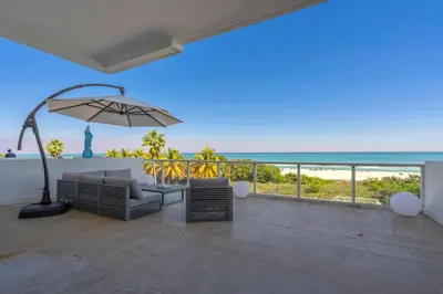 a patio with a view of the ocean at Huge Balcony Oceanfront 2 Bedrooms with Free Parking in Miami Beach