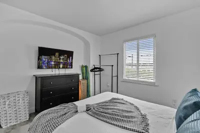 a bedroom with a bed with a bow tie on it at Lovely 1 BR Walking Distance To Ocean - Suite 1 in Hollywood