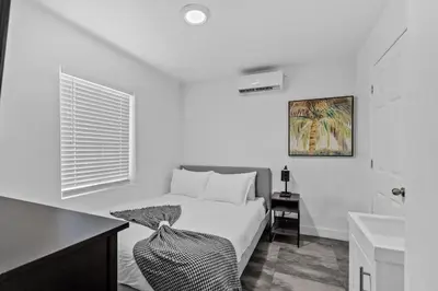 a white bedroom with a bed and a sink at Cozy Studio 2 Blocks from the Beach - Unit #3 in Hollywood