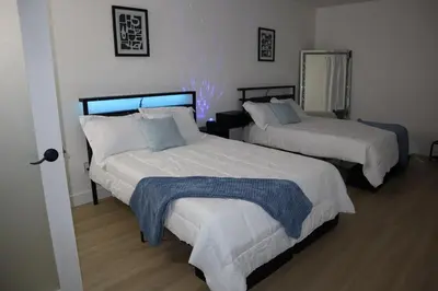 a bedroom with two beds in a room at Modern house with pool close to HARD ROCK in Pembroke Pines