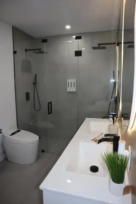 a bathroom with a sink and a shower and a toilet at Modern house with pool close to HARD ROCK in Pembroke Pines