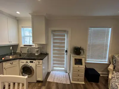 a kitchen with a washer and dryer in a room at Beachside One Bedroom Condo with Pool Access in Hollywood