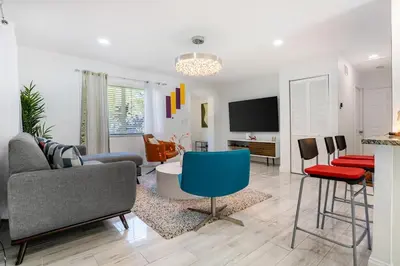 a living room with a couch and chairs at Tropical Retreat- Heated Pool 3 Miles to the Beach in Fort Lauderdale