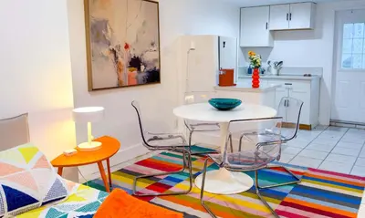 a kitchen with a table and chairs in a room at Take It Easy - Studio Pool Waterfront in Fort Lauderdale