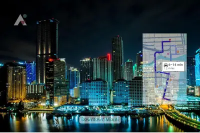 a night view of a large city with buildings at Sky-High Urban Sanctuary with Coastal Glimpses in Miami