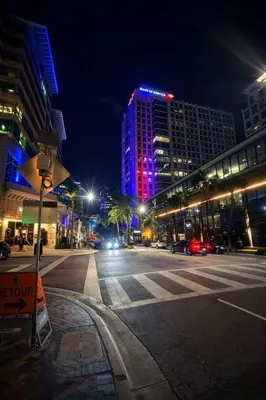a city street at night with a lit up building at Ariia Fort Lauderdale Airport in Fort Lauderdale
