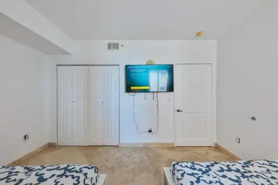 a room with a flat screen tv on a wall at Blue Horizon at Sunny Isles King David in Sunny Isles Beach