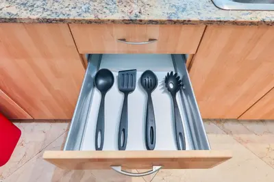 a utensil holder with cutlery in a kitchen at Blue Horizon at Sunny Isles King David in Sunny Isles Beach