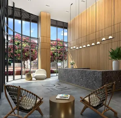 a lobby with two chairs and a reception desk at Elegant Condo Near Bayside in Central Miami in Miami