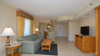 a living room with a couch and a tv at 2 BR-11th Floor Corner Unit - Fort Lauderdale Beach Resort in Fort Lauderdale