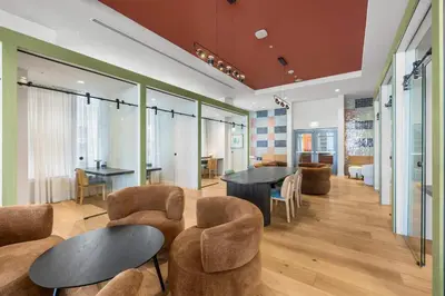 a lobby with two tables and chairs and a dining room at Central Downtown Miami Condo Featuring Rooftop Pool in Miami