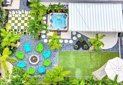 an overhead view of a backyard with a pool and a lawn at Tropical Bliss 15 Min to Beach in Plantation