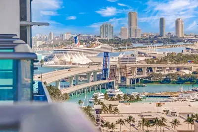 a view of a harbor with cruise ships and a city at MIA Worldcenter Premium 1BR Balcony & Rooftop Pool in Miami