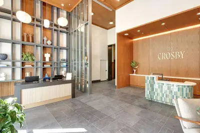 a lobby of a company with a reception desk and a lobby at MIA Worldcenter Premium 1BR Balcony & Rooftop Pool in Miami