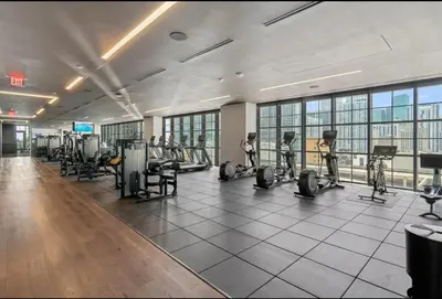 a gym with treadmills and exercise equipment in a building at Chic studio in Downtown with Gym and Pool in Miami