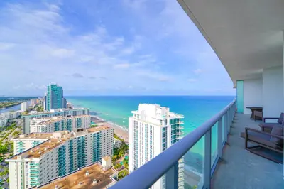 a balcony with a view of the ocean and buildings at Oceanfront Escape - Rooftop Pool & Beach Access in Hollywood