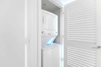 a white laundry room with a washer and dryer at Ocean Views Plus Beachside & Roofpool in Hollywood