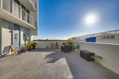 a balcony of a building with a table and chairs at Elegant Condo with Stunning Views in Dtwn Hollywood in Hollywood