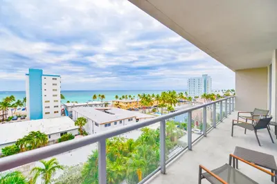 a balcony with a view of the beach at Ocean View Stay with Rooftop Pool Near the Beach in Hollywood