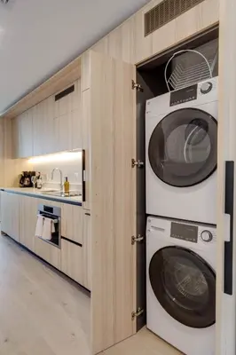 a kitchen with two washing machines and a sink at Sky Corner Residence- Pool Parking Amenities in Miami