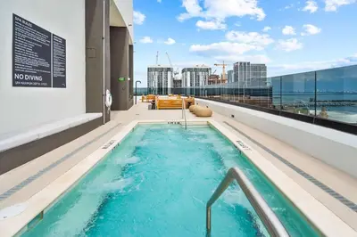 a hot tub on the roof of a building at Miami Skyline 1BR Sleeps 4 with Elite Amenities in Miami