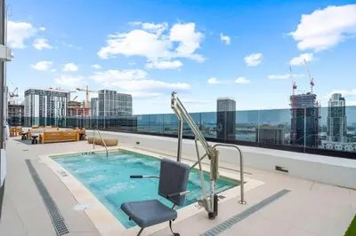 a swimming pool on the roof of a building at Miami Skyline 1BR Sleeps 4 with Elite Amenities in Miami