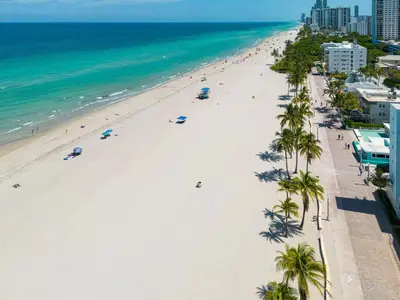 an overhead view of a beach with palm trees and the ocean at Vista Del Mar - by Atlantikos in Hollywood