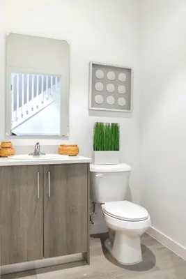 a bathroom with a toilet and a sink at Spacious Entire Duplex for Family Stay in Miami