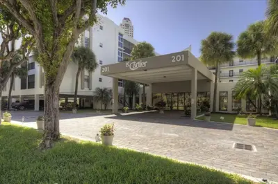 a building with a sign that reads hotel at Le Cartier 207 STR-02440 in Sunny Isles Beach