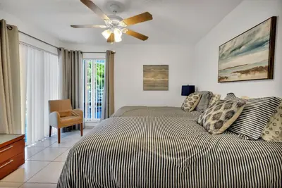 a bedroom with a bed and a ceiling fan at Le Frontenac 204 STR-01054 in Sunny Isles Beach