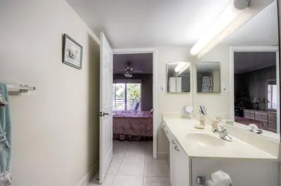 a bathroom with a sink and a mirror at Le Frontenac 205 STR-01057 in Sunny Isles Beach