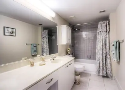 a bathroom with a tub and a sink and a toilet at Le Frontenac 205 STR-01057 in Sunny Isles Beach