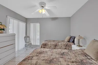 a bedroom with a bed and a ceiling fan at Le Frontenac 210 STR-01055 in Sunny Isles Beach