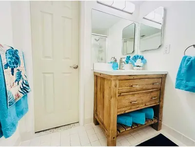 a bathroom with a sink and a mirror at Le Frontenac in Sunny Isles unit 402 STR-03003 in Sunny Isles Beach