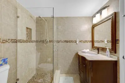a bathroom with a shower and a sink at Le Frontenac 413 STR-03005 in Sunny Isles Beach