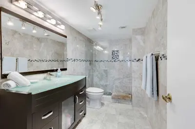 a bathroom with a sink and a toilet at Le Frontenac 413 STR-03005 in Sunny Isles Beach