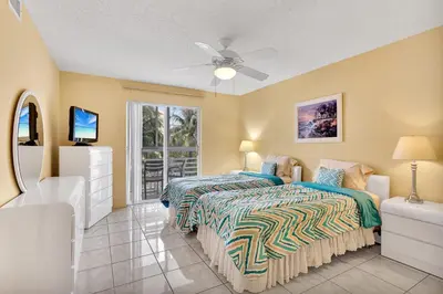 a bedroom with two beds and a ceiling fan at Le Frontenac 414 STR-01532 in Sunny Isles Beach