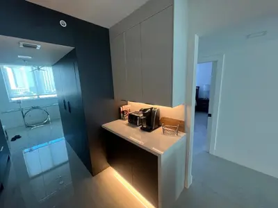 a bathroom with a counter and a sink in a room at Le Marina Bay 1001 STR-01504 in Sunny Isles Beach