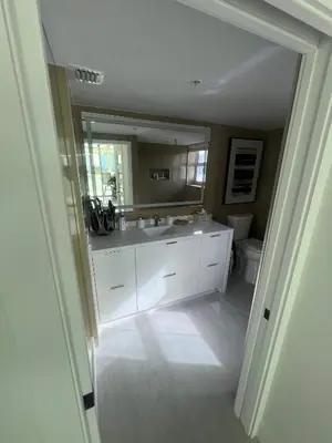a bathroom with a sink and a mirror at Le Marina Bay 1001 STR-01504 in Sunny Isles Beach